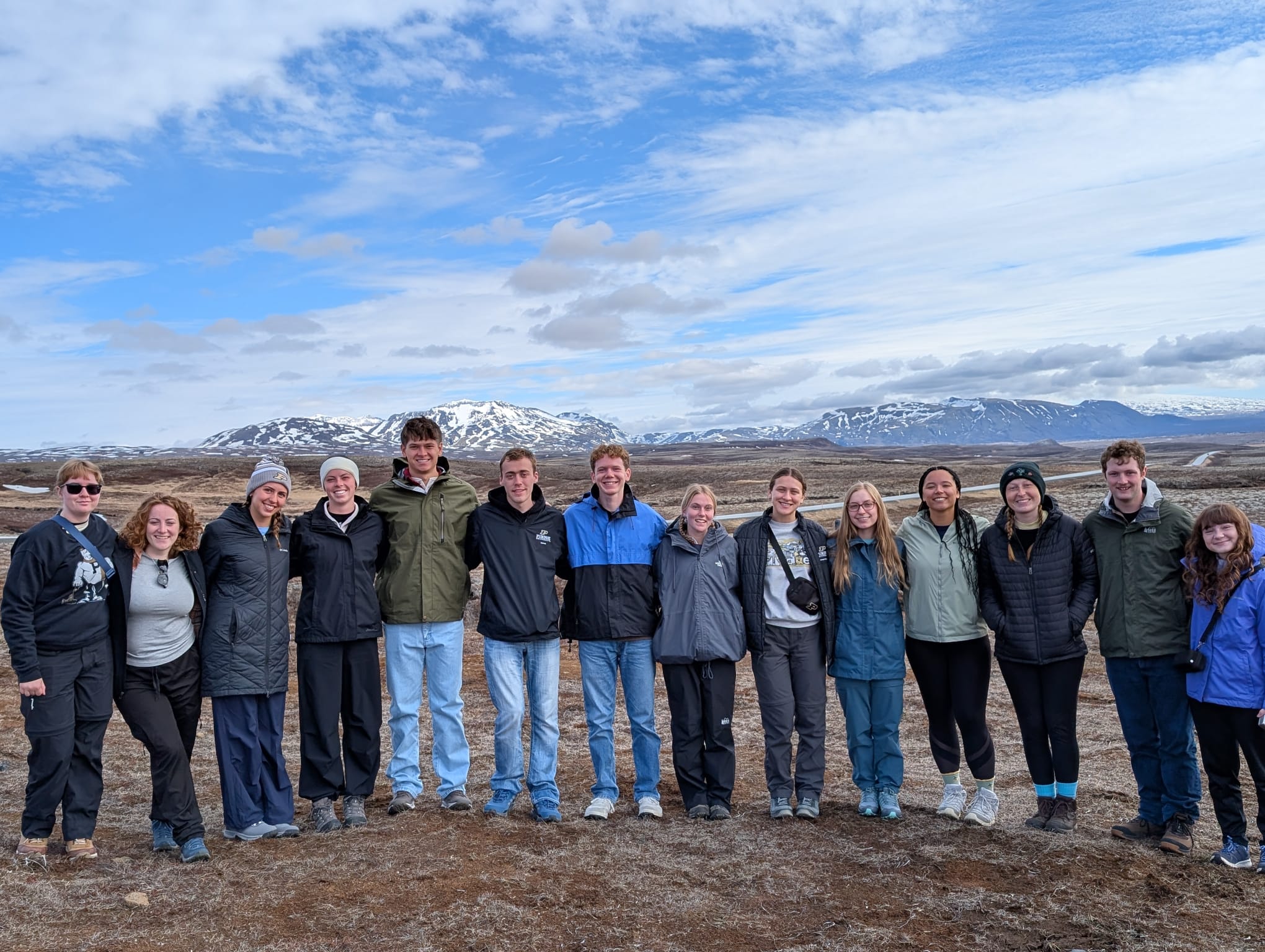 Iceland study abroad group standing in a line in front of mountains