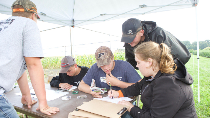 students taking notes at crops judging contest