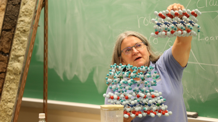 soil lab teacher demonstrating molecular structure