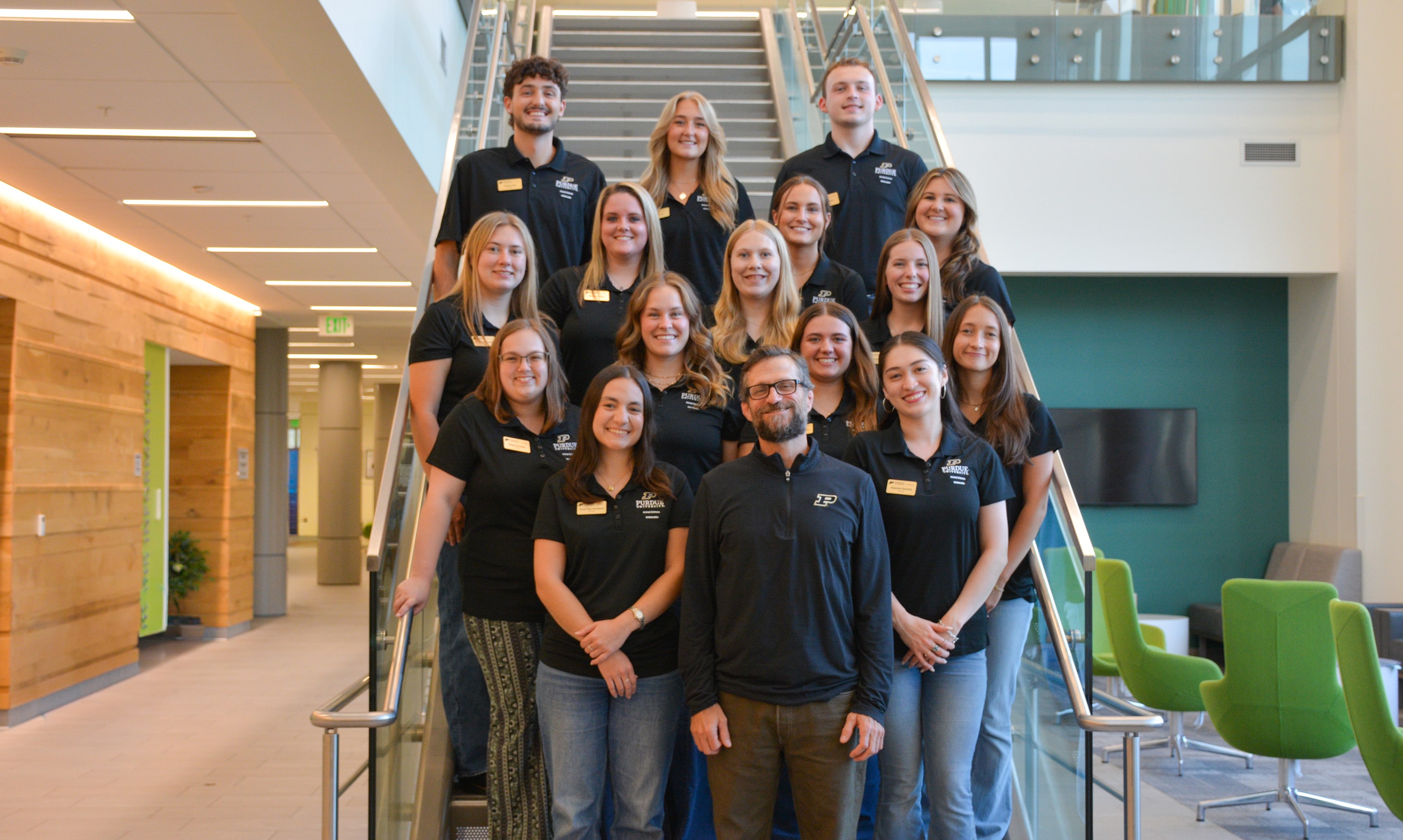 The Animal Sciences Ambassadors stand on stairs.