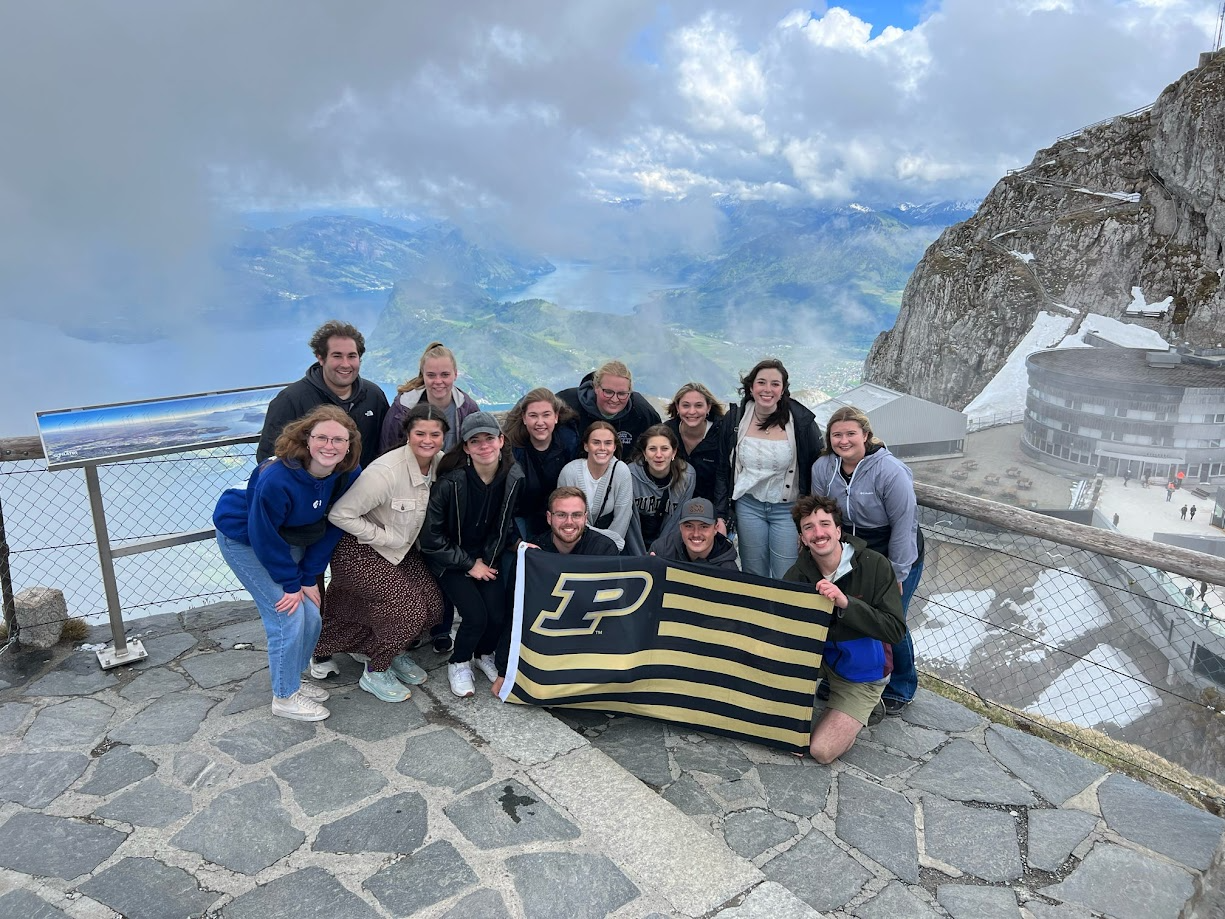 a group of students holding a flag