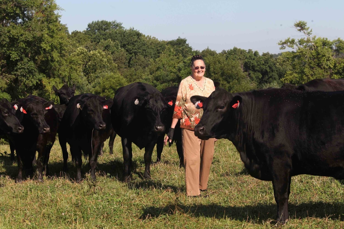Judy Chandler in the farm near her cattle