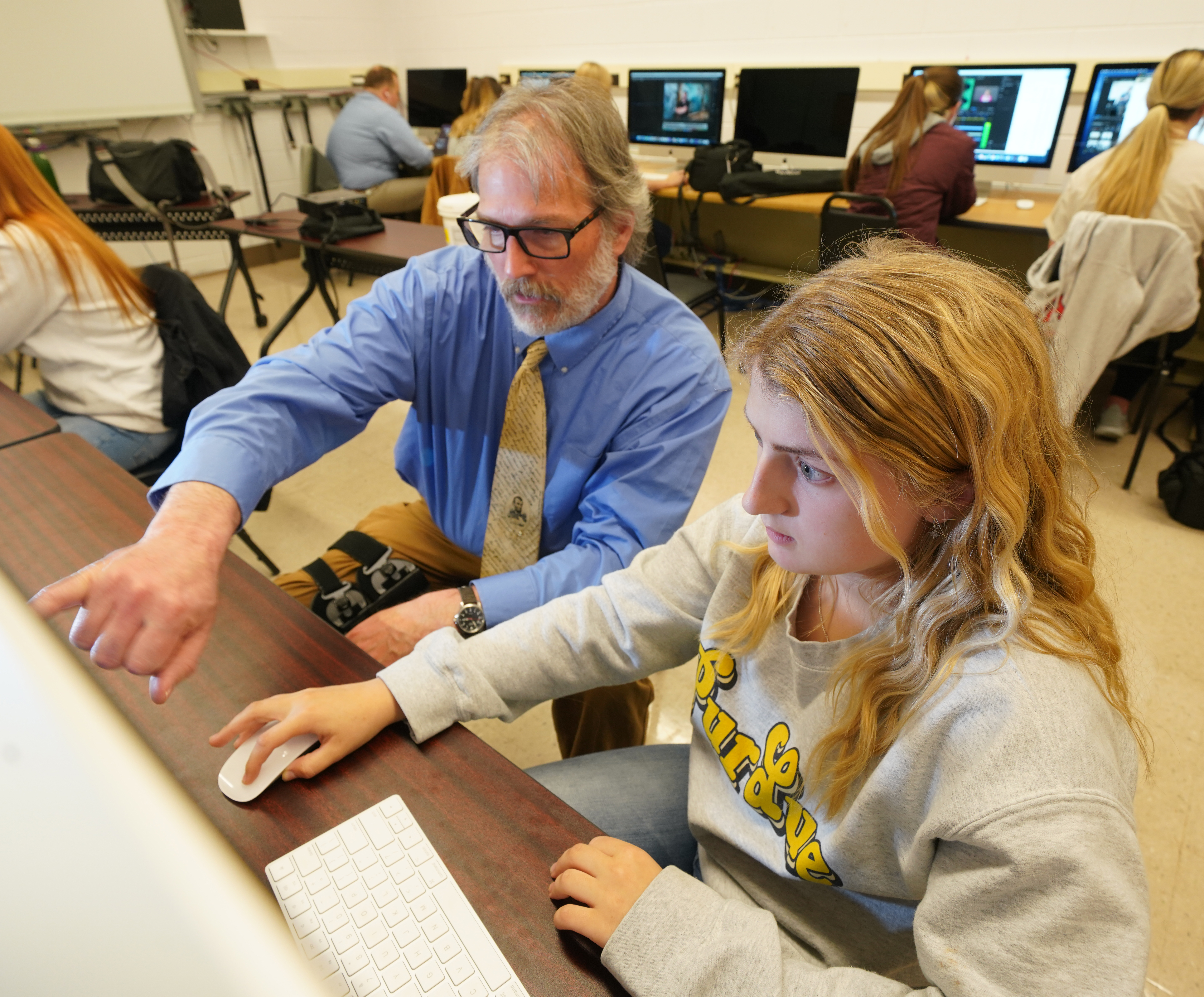 Instructor and student in computer lab