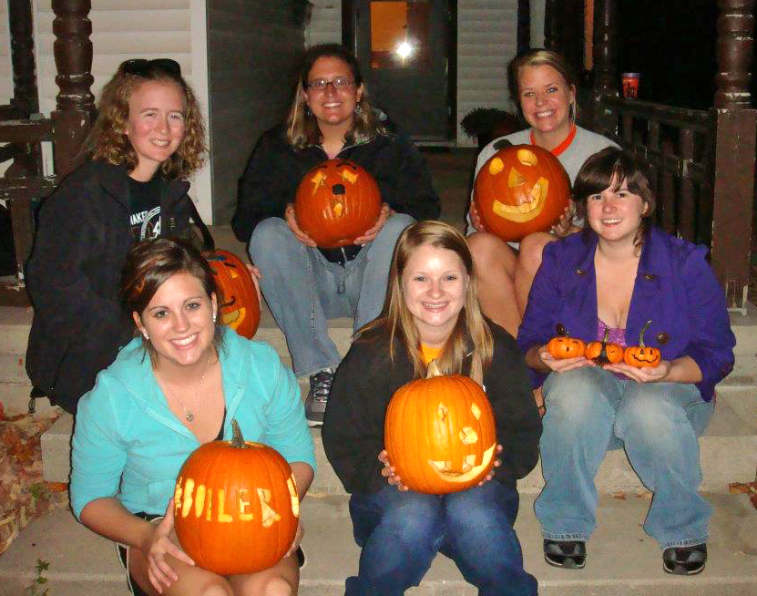 ACT members with carved pumpkins