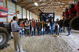 Students get an up-close view of agricultural machinery. 