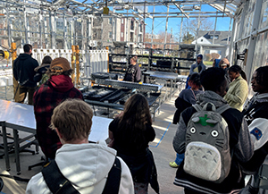 Students examine the hydroponics lab 