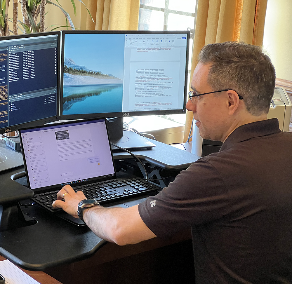 Roberto Gallardo working at his desk