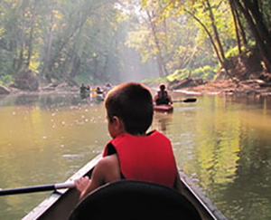Kids canoeing on Blue River, Corydon, Indiana.