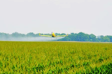 airplane doing aerial herbicide application 