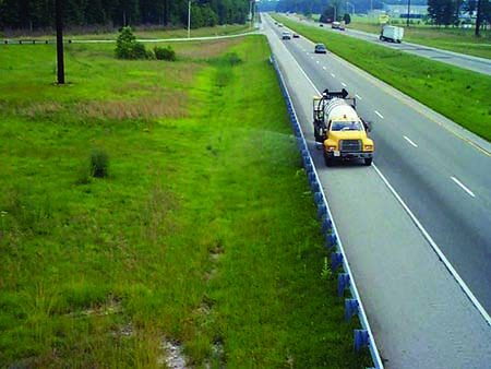 truck carrying pesticide tanks on the road 