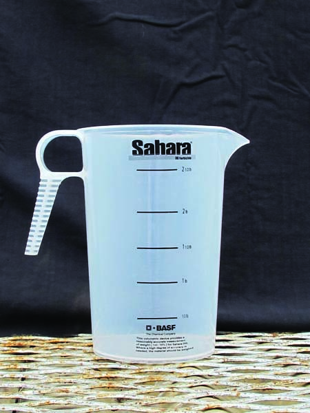 plastic measuring pitcher displays fluid ounces on one side
