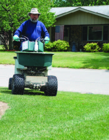 Person mowing lawn