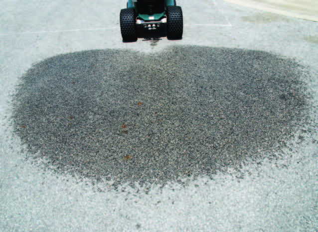 Feather edge spray pattern of the rideon sprayer over pavement