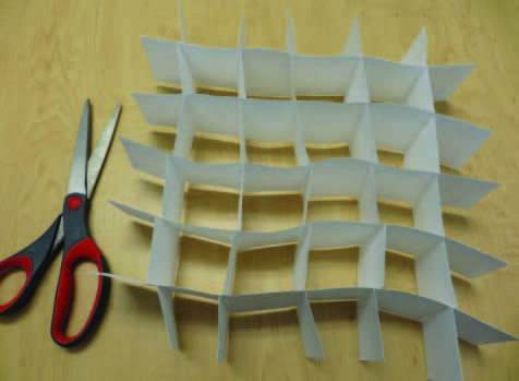 After making several strips with slits, fit the strips together using the slits to make baffles.