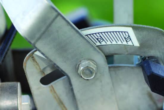 The spreader gate opening lever varies by spreader model. The settings on a PermaGreen® (left) are numbered 0 to 30