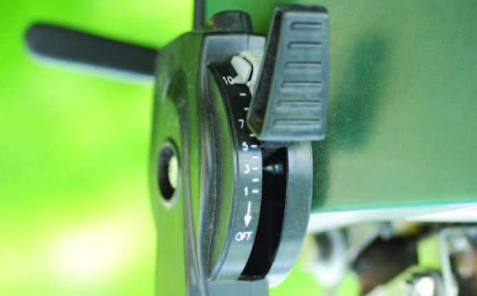 The pattern adjustment lever varies by spreader model. You control the pattern on a PermaGreen® with the third hole adjustment operating lever