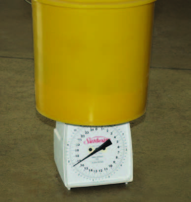 Use a scale like this one or a bathroom scale to weigh the product left in the hopper after the calibration run.