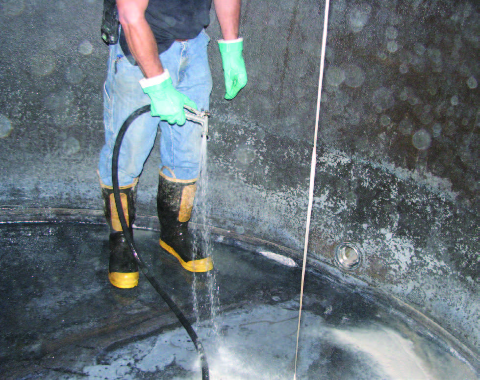 professional-with-equipment-cleaning-the-tank-2.jpg