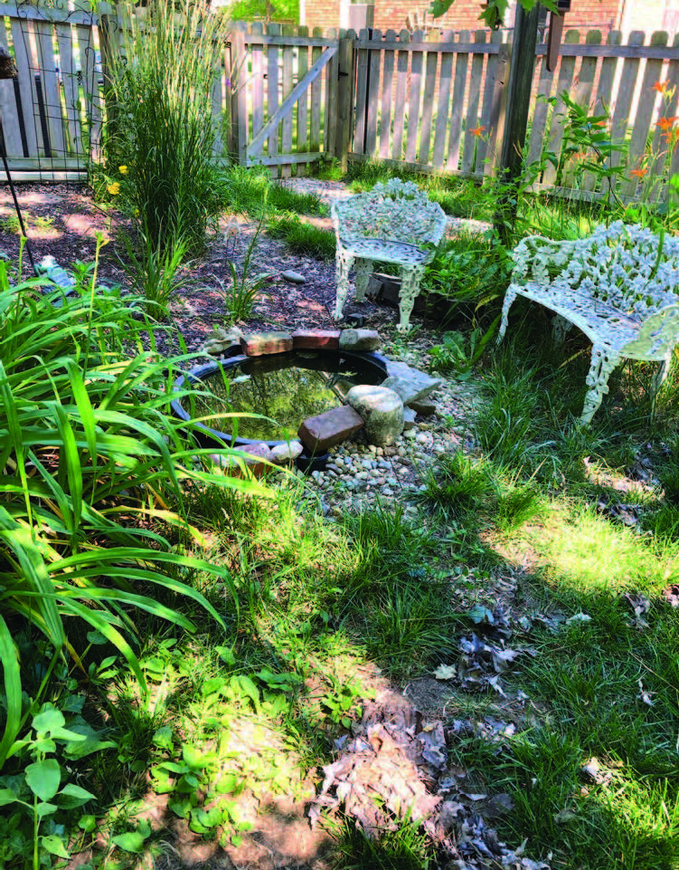 chairs with a small fish pond