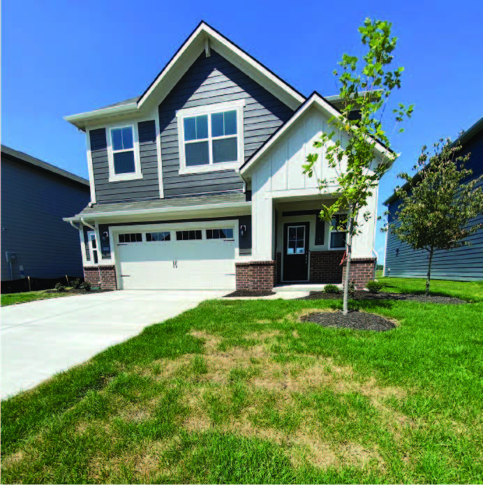 House with trees in the front yard