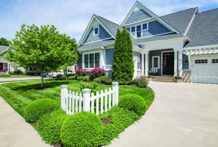 Sloped roof house with lawn in the front