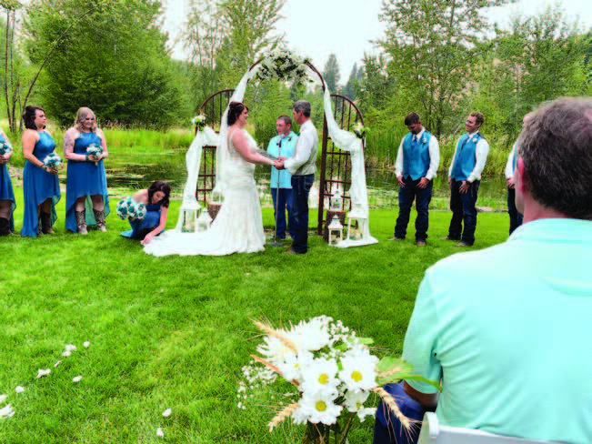 A couple getting married in the yard