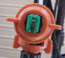 These nozzle has a 110° spray width. The nozzle with green tip is a 0.15-gallon per minute nozzle (at 40 psi). The green nozzle would more closely align with what we expect to get out of the drone.