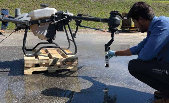 person inspecting the drone