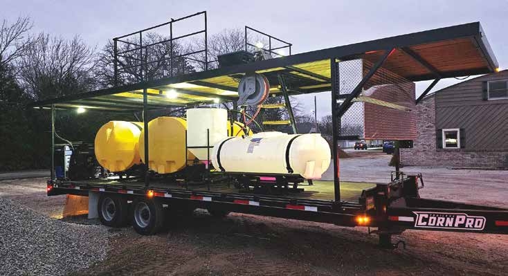 trailer truck with cylinders and platform to stand while operating drones
