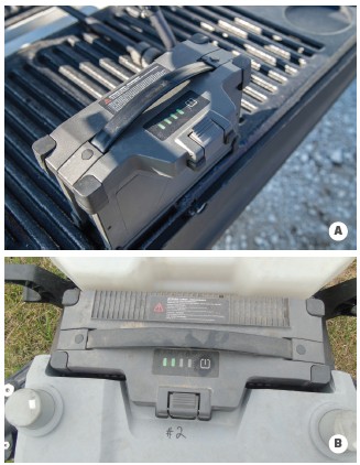 Most batteries have lights that indicate how much battery life remains. (A) These four lights indicate the battery is fully charged. (B) This battery has used up half of its battery charge