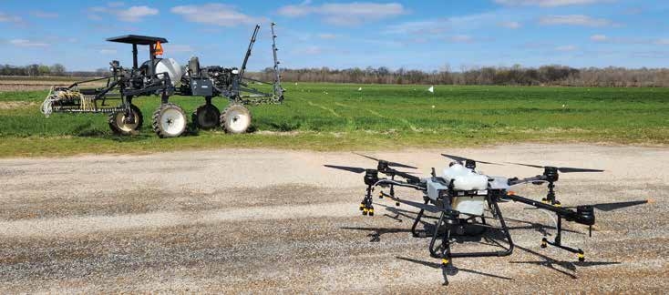 Spray drone being operated by farmer