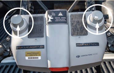 The drone receives a signal from the controller via its two antennae. The two black panels on the side of the receiver allow air flow that helps keep the hardware in the drone from overheating.