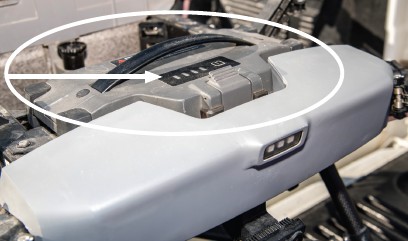 This battery snaps into place. The four light panels on the battery indicate how much battery life remains.