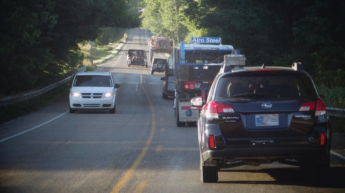 Vehicles stuck behind a slow moving truck
