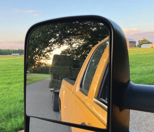 it is important to have clear views of what is on your right and left sides and behind you while transporting hay.