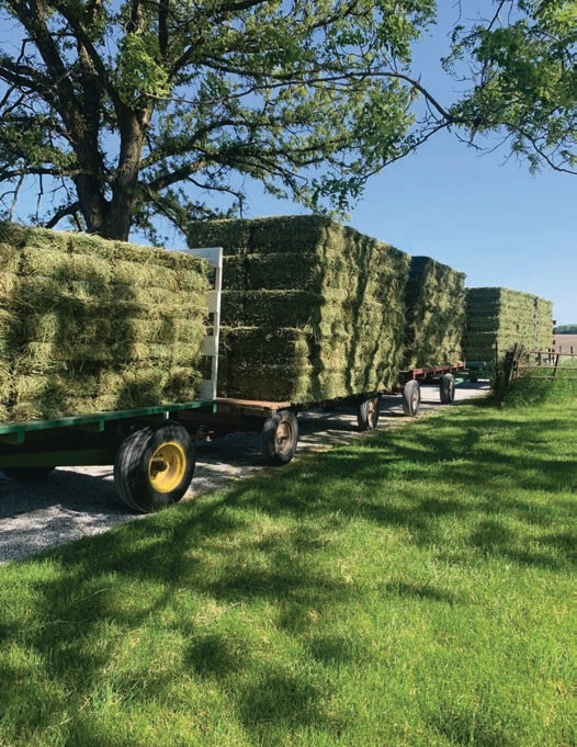 A truck pulling 3 wagons on public roads