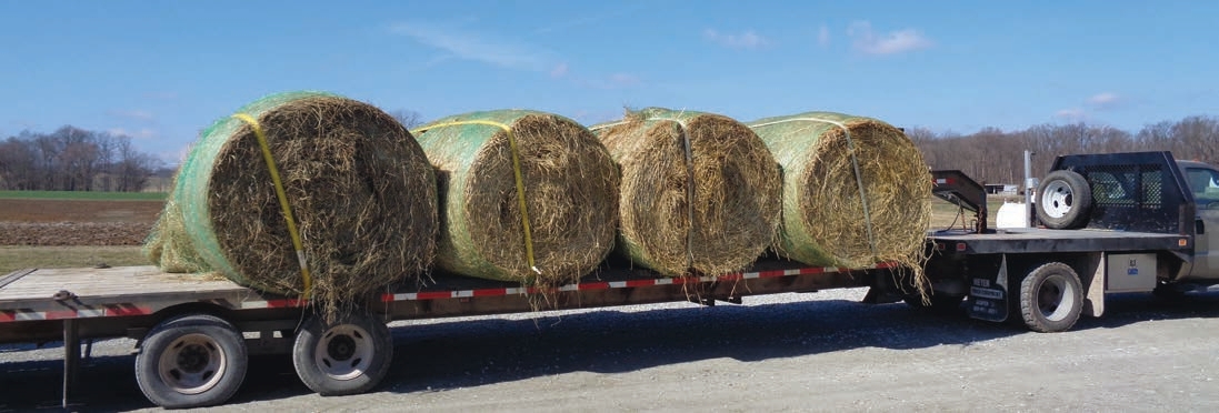 There is nothing really holding each row of two round bales together so treat each bale across the deck as a separate load. If each bale weighs 750 pounds, then two bales would weigh 1,500 pounds