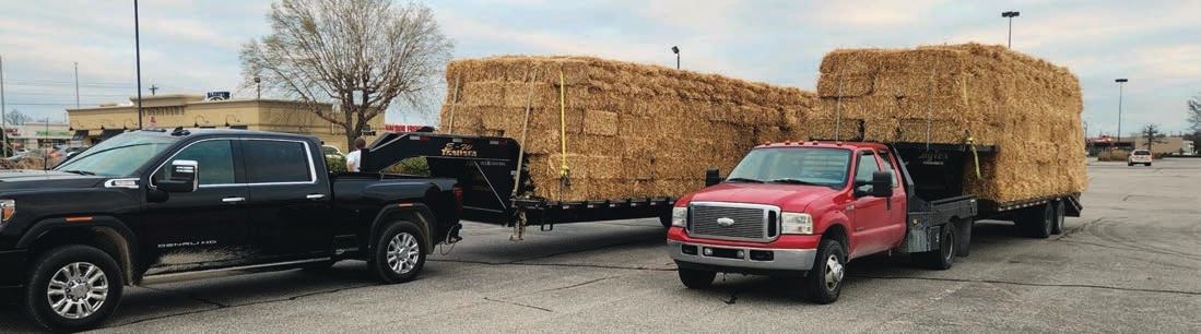 These two trailers are using two parallel straps to go from the front to the back. However, there are no straps going from side-to-side. The operator added an extra strap in the front to help keep the top layers from shifting forward. Still, the operator needs to place additional straps along the sides at 10-foot intervals. 