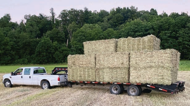 The truck and gooseneck trailer will travel faster than 25 mph so a slow-moving vehicle sign is not required