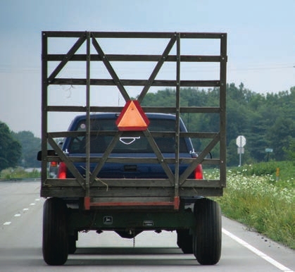The truck will travel faster than 25 mph so a slow-moving vehicle sign is not required