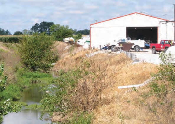 Large ditches near your facility are enough to cause flooding. If high enough, floodwaters can even run back into the drainage pipes shown in the photos above.