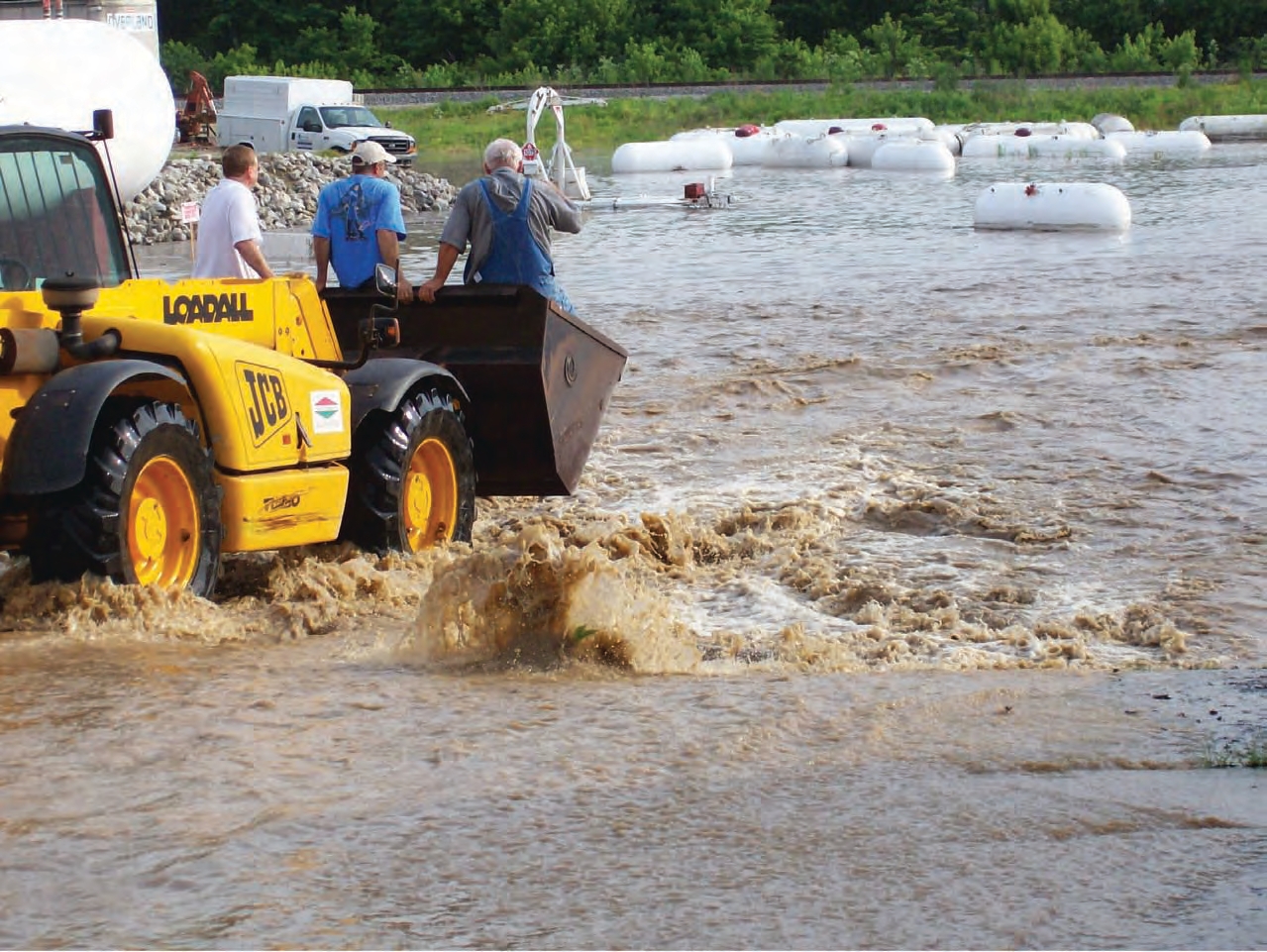 JCB truck helping people stuck in flood