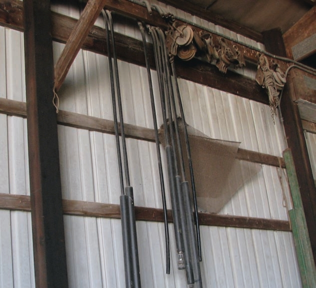 The hoses shown here are stored indoors, but hanging them like this may stretch them — the outside covers could come loose from the inside cores.