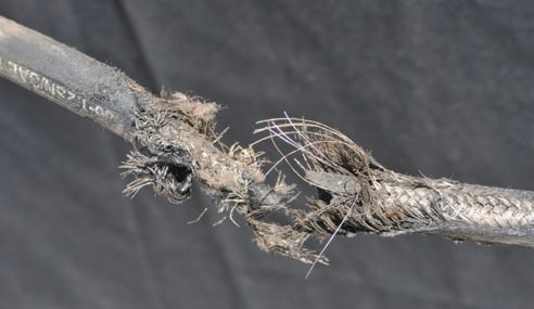 This hose failed where it was subject to continuous abrasion.
