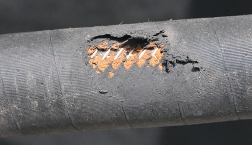 When hoses are abraded like these, their pressure ratings fall.