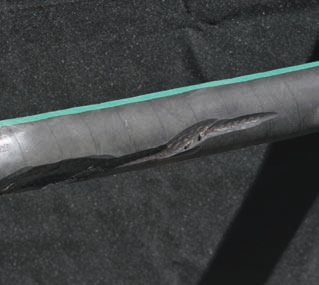 These photos show hoses worn from rubbing. Even covers might not protect underlying hose layers as shown in the photo of the orange hose.
