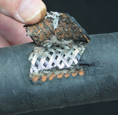 Cuts in hose covers expose the reinforcement, which can lead to a premature failure