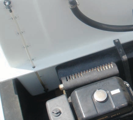 The clear hoses on these tanks gauge the level of fluid they contain. Only open the valve to these hoses when you want to check the level in the tank. If the hose fails when the valve is open, some or all of the tank’s contents can be spilled.