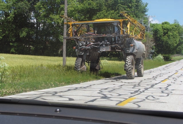 On narrow country roads, farm equipment often needs to stop and let an oncoming vehicle proceed
