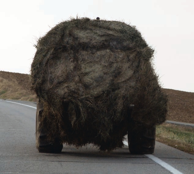 Slow-moving vehicle signs warn other drivers on the road. Not having such signs could pose a legal risk in the event of an accident.